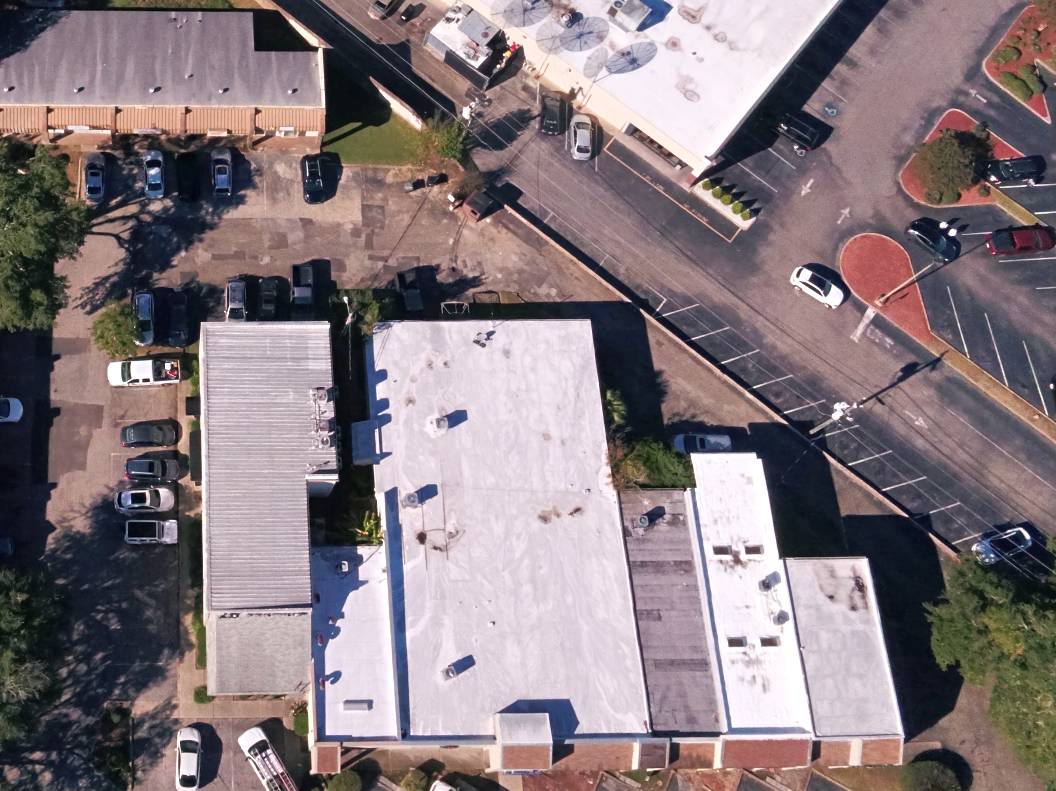 Roof maintenance at the shopping and office complex on Thomasville Road Tallahassee