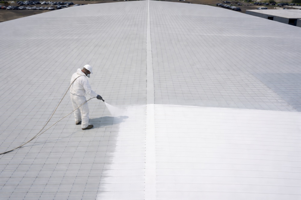 Illustration of silicone coating application to the metal roof we installed at Marianna Chevrolet